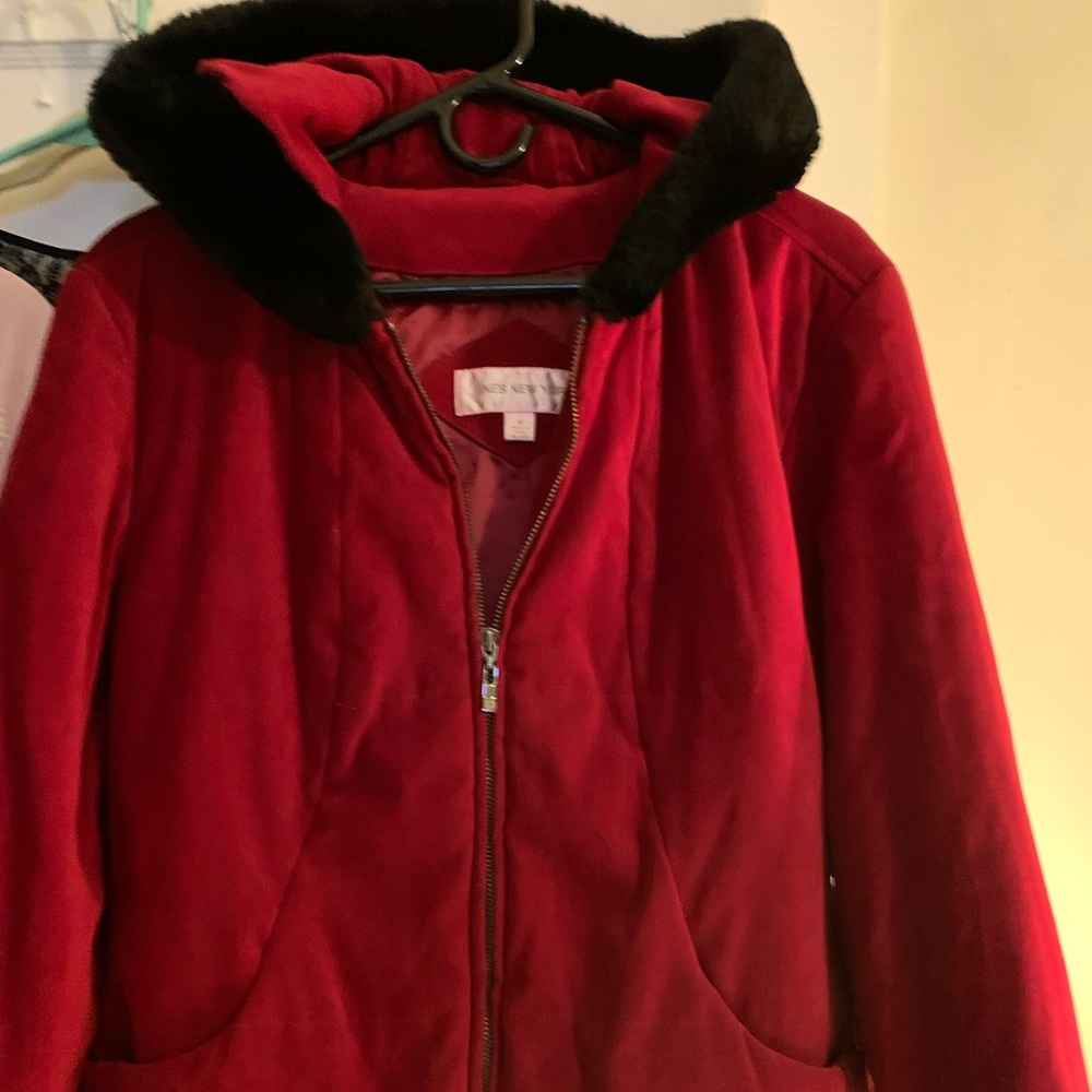 Womens coat good condition. Smoke free red with black fur around hood.